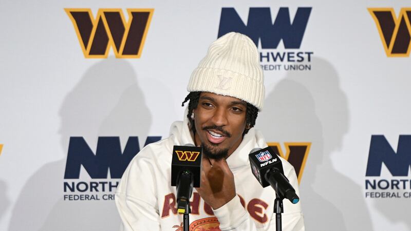 Washington Commanders quarterback Jayden Daniels speaks during a news conference after an NFL...