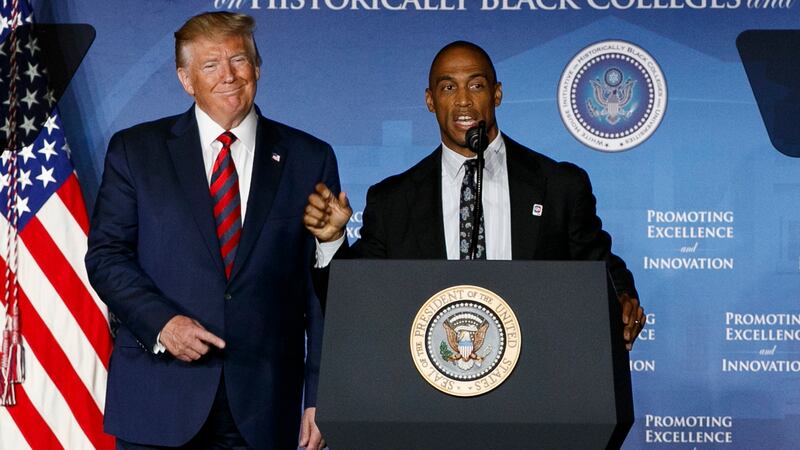 FILE - President Donald Trump points toward Scott Turner, Executive Director of the White...