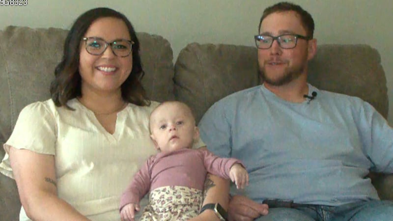 Millie James Dwyer, 5 months, is held by her mom, Tayla Schager, and dad, Dylan Dwyer.